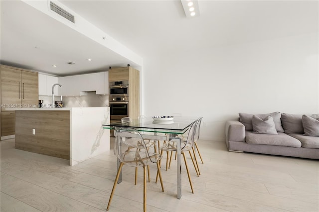 dining area featuring sink