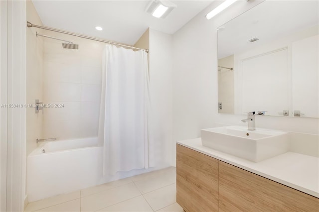 bathroom featuring vanity, shower / tub combo with curtain, and tile patterned floors