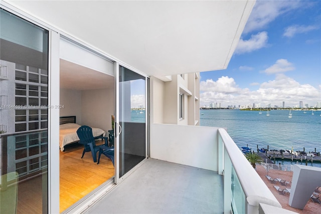 balcony featuring a water view