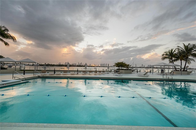 view of pool at dusk