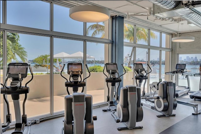 gym featuring a water view