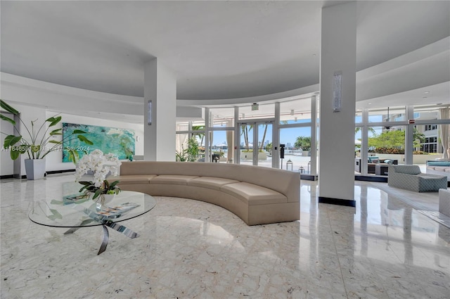 living room with french doors and a healthy amount of sunlight