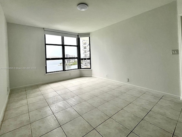 empty room with light tile patterned flooring