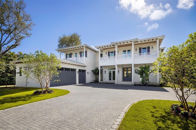 back of house with a patio, a balcony, ceiling fan, and a pool with hot tub