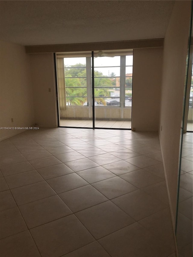 empty room with light tile patterned flooring