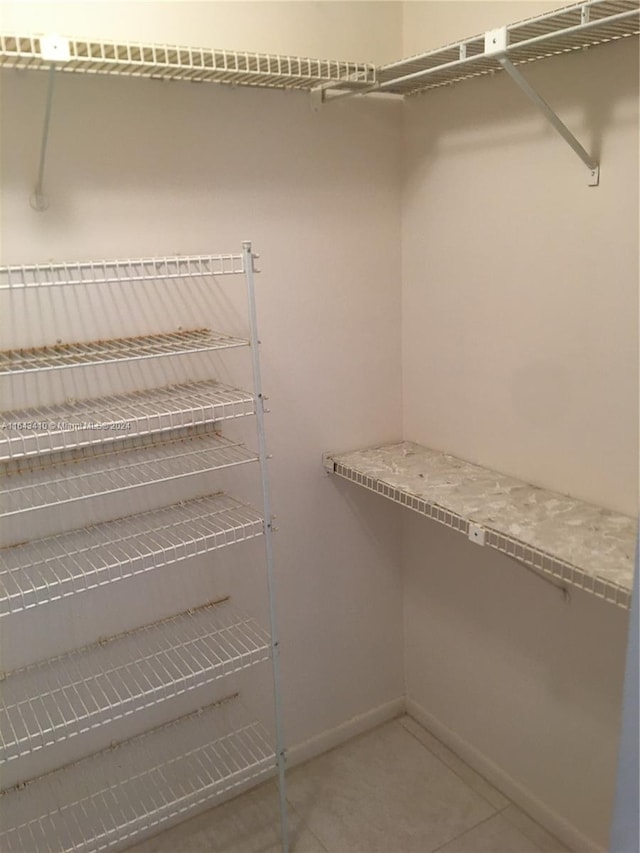 walk in closet featuring tile patterned floors