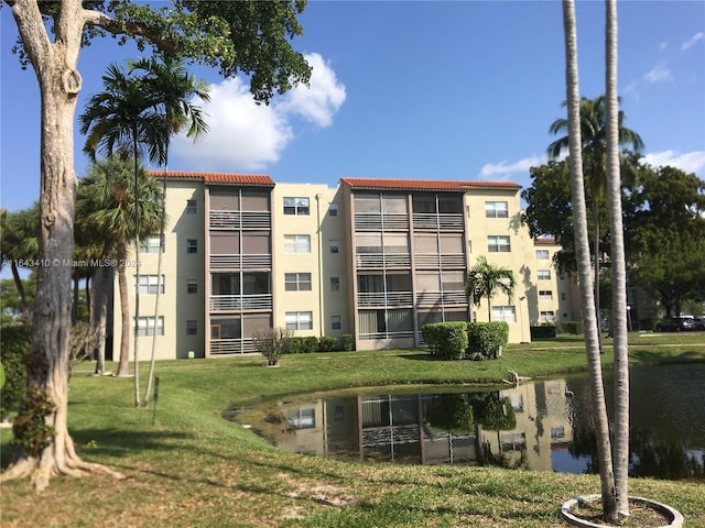 view of building exterior featuring a water view