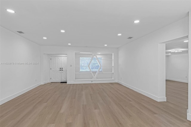 spare room featuring light hardwood / wood-style floors