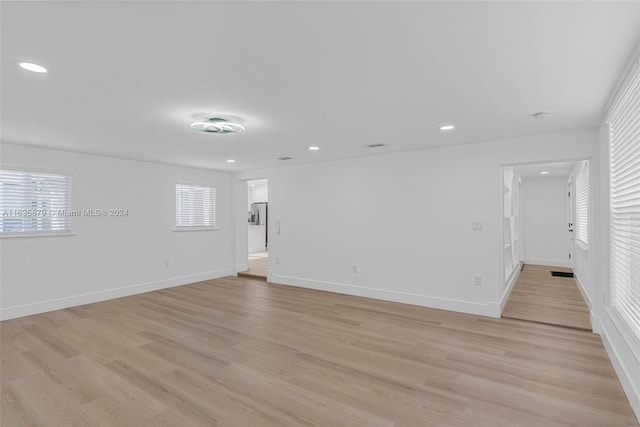 empty room with light wood-type flooring