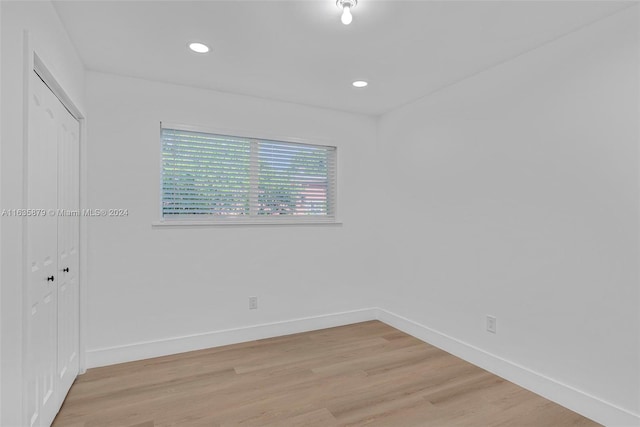 spare room featuring light hardwood / wood-style flooring