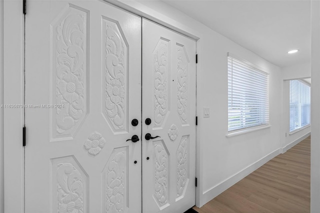 entryway with light hardwood / wood-style flooring