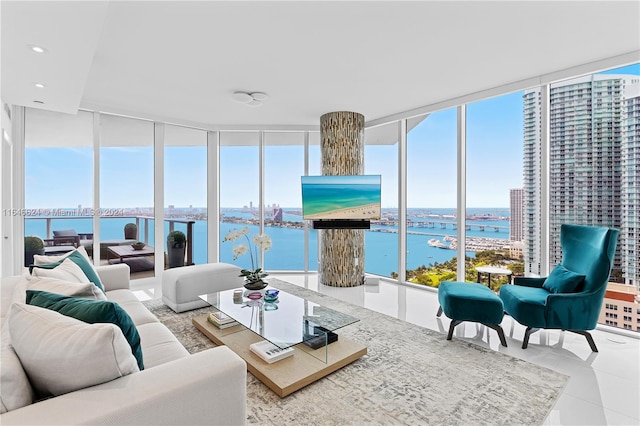 tiled living room featuring a wall of windows and a healthy amount of sunlight