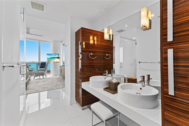 bathroom with tile patterned flooring, ceiling fan, and vanity