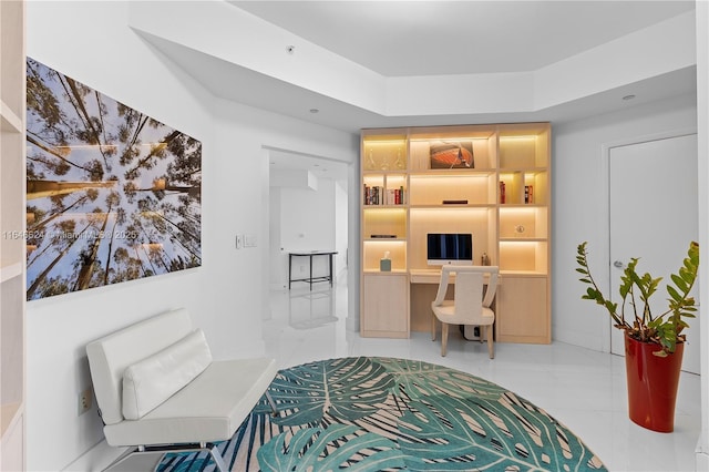 sitting room featuring built in desk