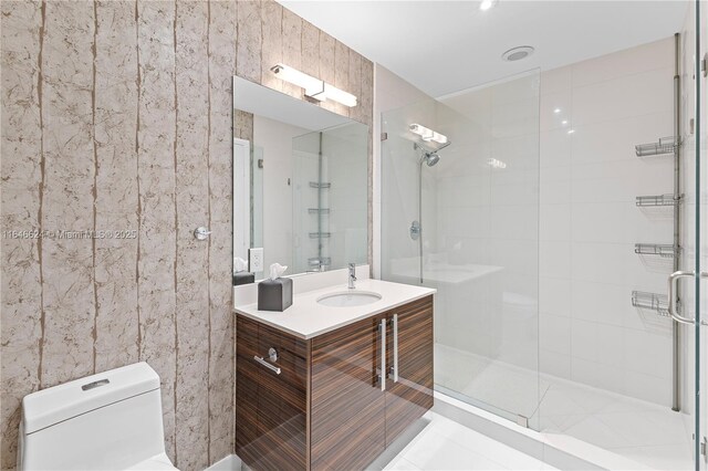 bathroom with tile patterned floors, toilet, and vanity