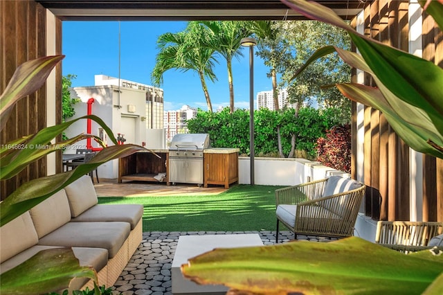 view of yard with an outdoor living space and a patio area