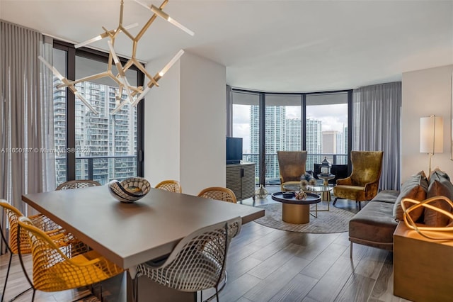 801 S Miami Ave Unit 2509, Miami, FL 33130 - dining area with floor to ceiling windows and wood finished floors