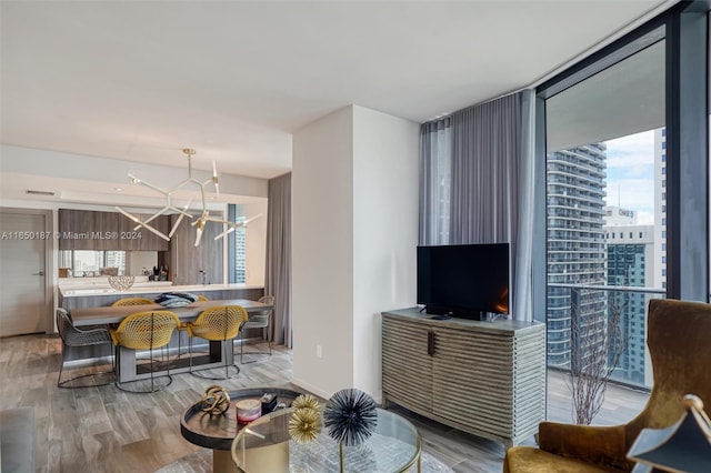 living room featuring hardwood / wood-style floors and a wall of windows