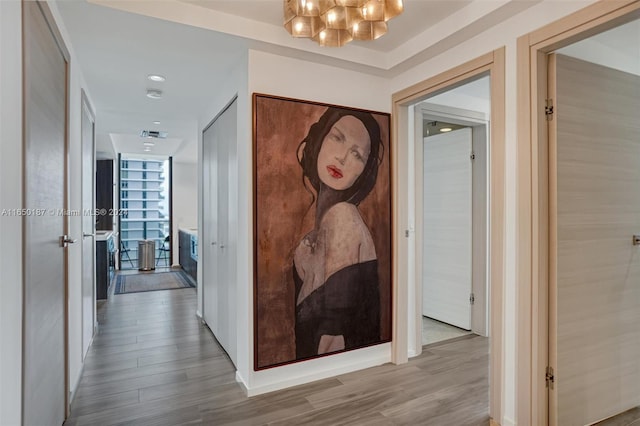 801 S Miami Ave Unit 2509, Miami, FL 33130 - hallway with wood finished floors, a chandelier, and expansive windows