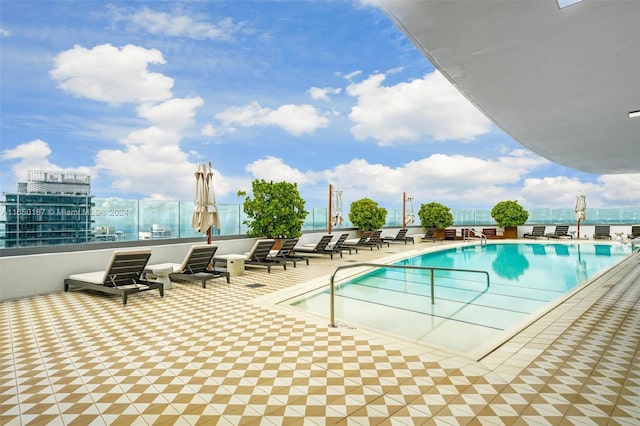 view of swimming pool with a patio area