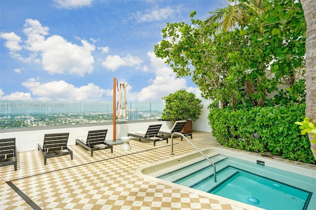 view of pool with an in ground hot tub