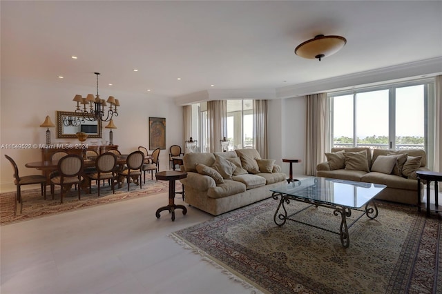 living area featuring recessed lighting, a notable chandelier, and crown molding