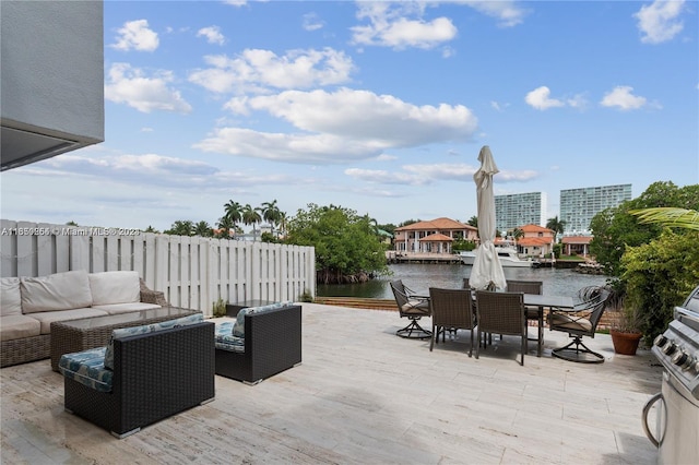 view of patio featuring a water view and an outdoor living space