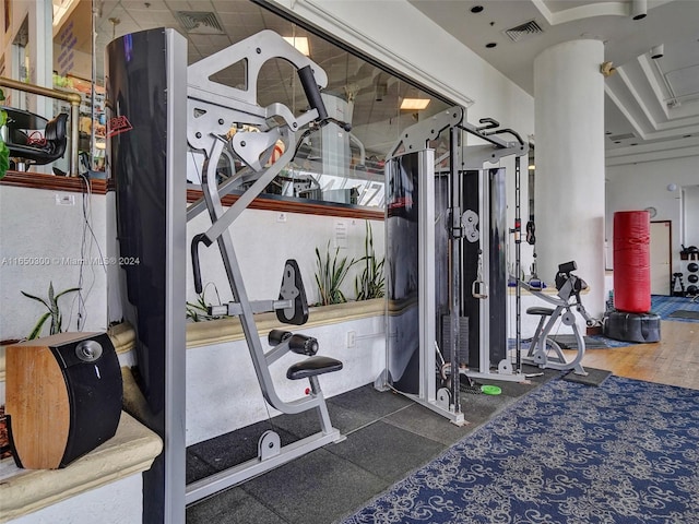 exercise room with dark wood-type flooring