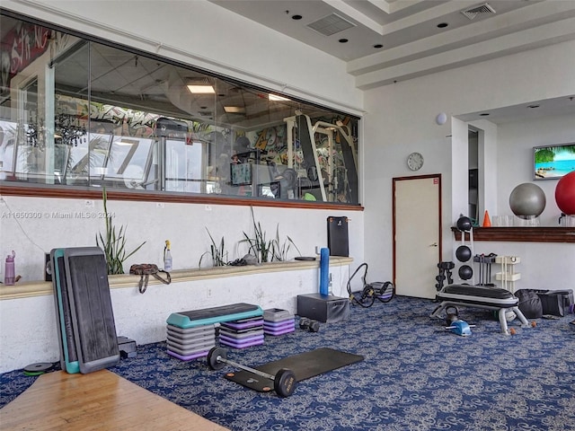 workout area with wood-type flooring