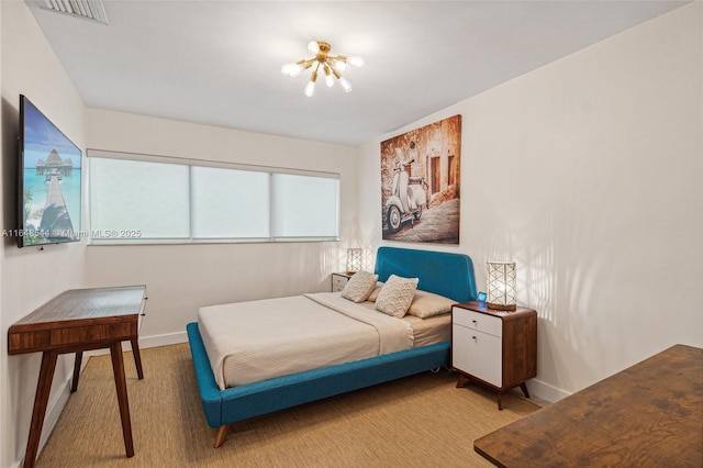 carpeted bedroom featuring visible vents and baseboards