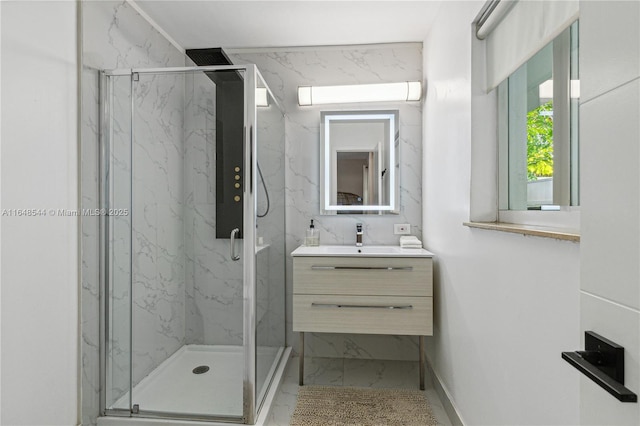 full bathroom featuring marble finish floor, vanity, and a marble finish shower