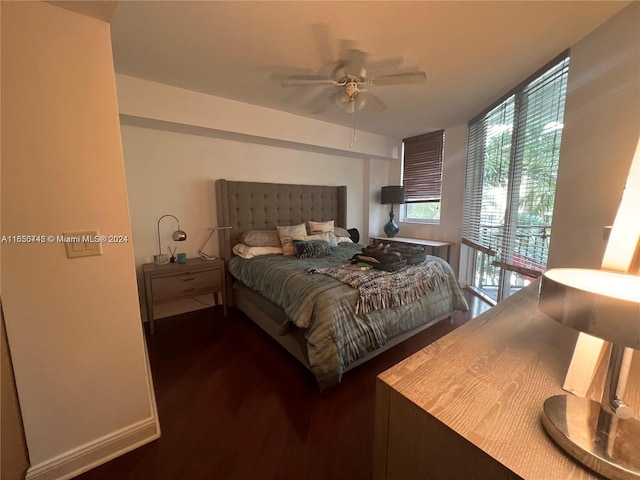 510 NW 84 Th Ave Unit 324, Plantation, FL 33324 - bedroom featuring baseboards, a wall of windows, ceiling fan, and dark wood finished floors