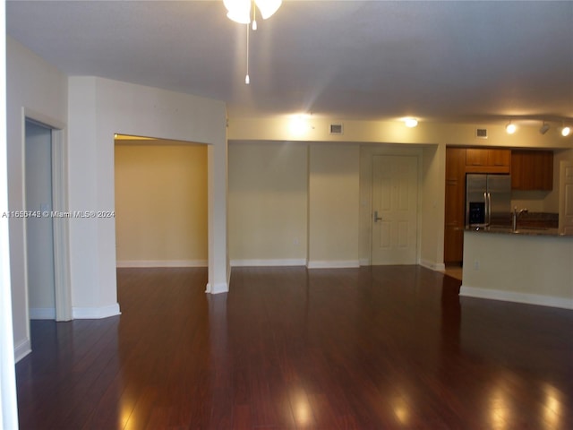 unfurnished room with sink and dark hardwood / wood-style floors