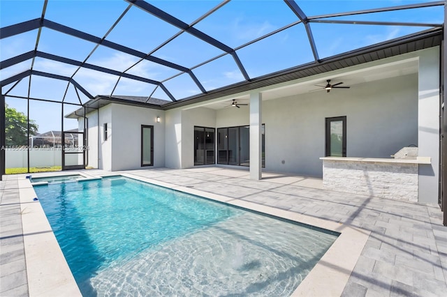 view of swimming pool featuring a patio area, ceiling fan, and a lanai