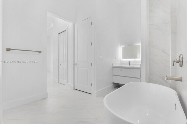 bathroom with a bath and vanity