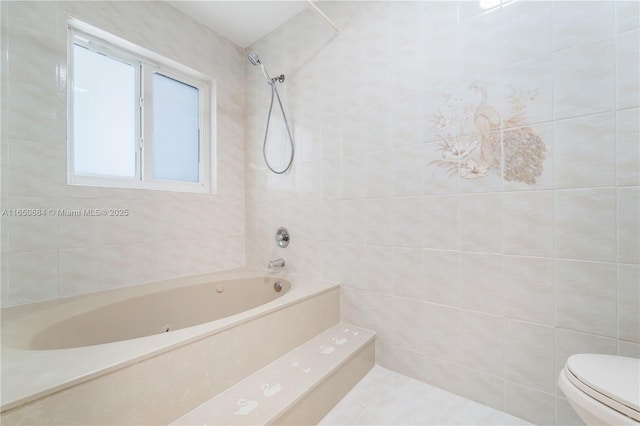 bathroom with shower / washtub combination, tile walls, and toilet