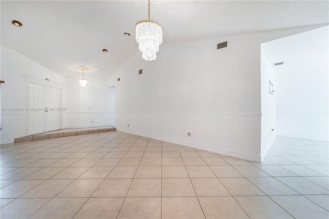 unfurnished room featuring light tile patterned floors, baseboards, visible vents, an inviting chandelier, and high vaulted ceiling