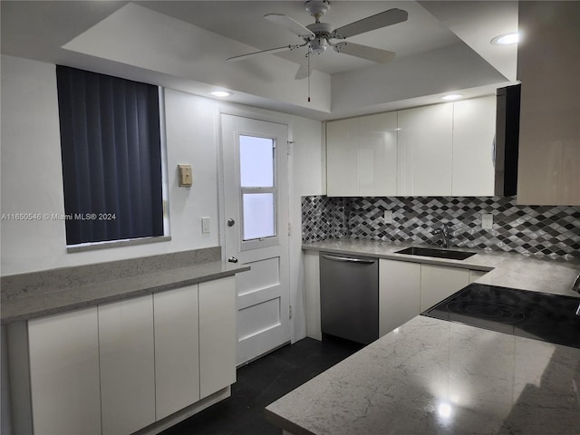 kitchen with ceiling fan, white cabinets, light stone counters, sink, and stainless steel dishwasher