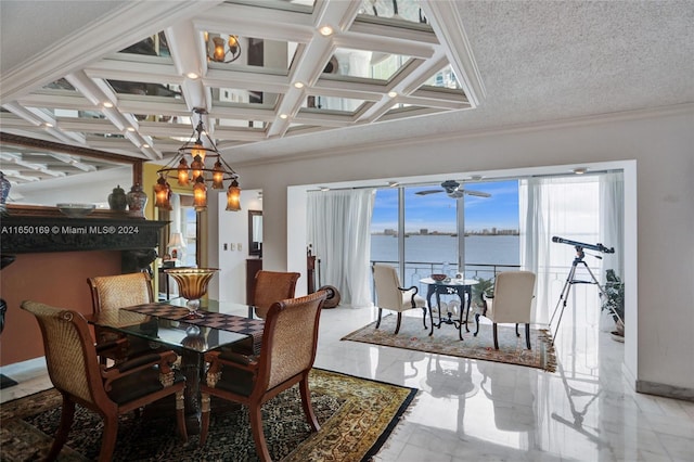 dining space with a water view, ornamental molding, a textured ceiling, and a healthy amount of sunlight