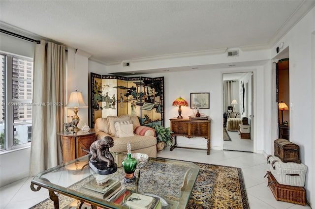 living room with ornamental molding, a textured ceiling, a healthy amount of sunlight, and light tile patterned floors