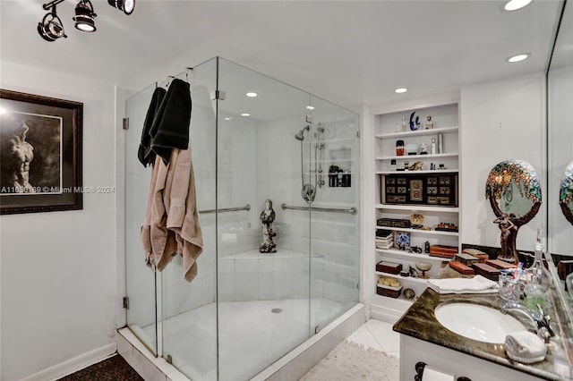 11111 Biscayne Blvd Unit 7F, Miami, FL 33181 - bathroom featuring built in features, a shower stall, vanity, and recessed lighting
