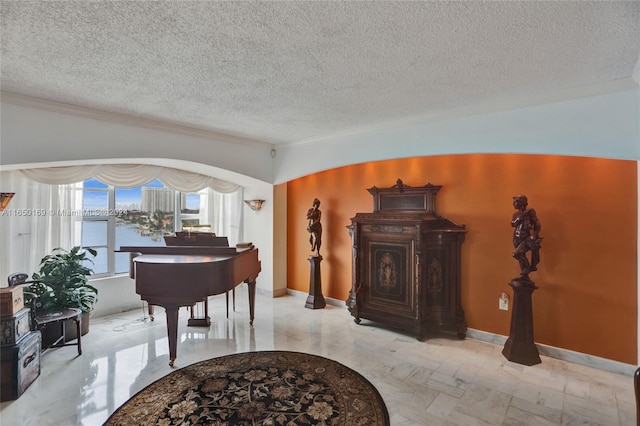 11111 Biscayne Blvd Unit 7F, Miami, FL 33181 - living area with ornamental molding, baseboards, and a textured ceiling