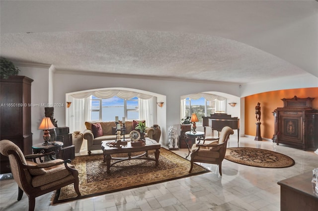 11111 Biscayne Blvd Unit 7F, Miami, FL 33181 - living area with arched walkways, marble finish floor, and a textured ceiling