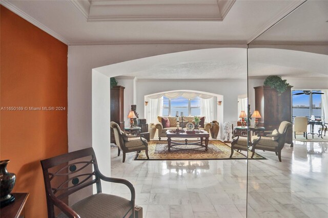 11111 Biscayne Blvd Unit 7F, Miami, FL 33181 - living area featuring crown molding, arched walkways, a raised ceiling, and marble finish floor