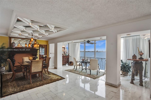 dining space with coffered ceiling, a textured ceiling, a water view, and an inviting chandelier