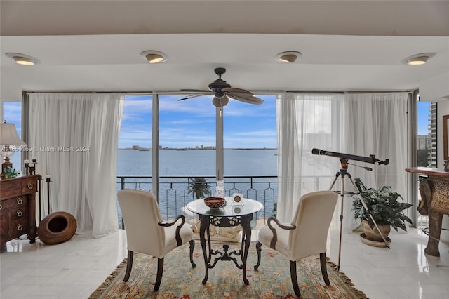 11111 Biscayne Blvd Unit 7F, Miami, FL 33181 - dining room with a water view and a ceiling fan