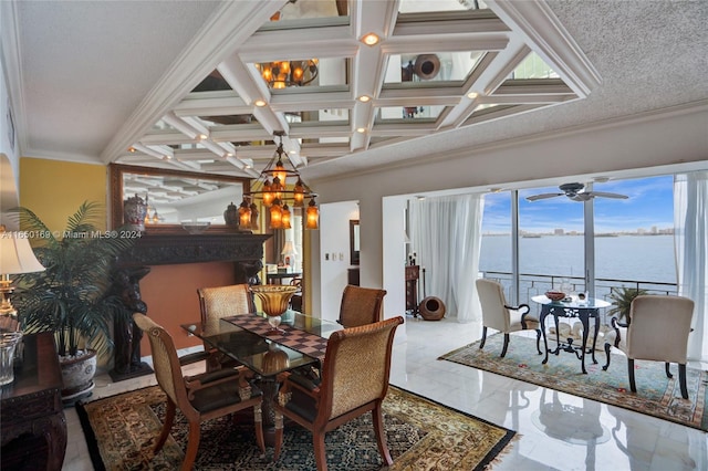 dining area with coffered ceiling, a water view, ornamental molding, a textured ceiling, and beam ceiling