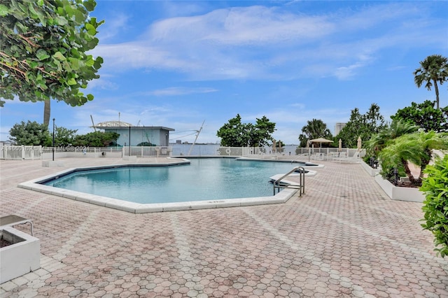 view of swimming pool with a patio area