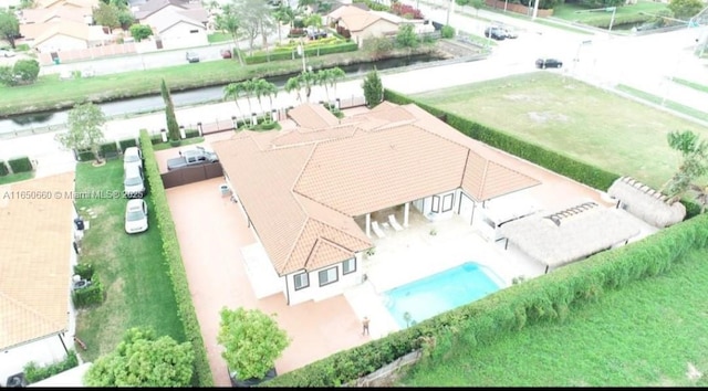 bird's eye view with a water view and a residential view