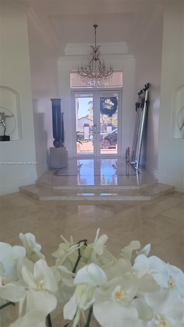 interior space featuring ornamental molding, french doors, and baseboards